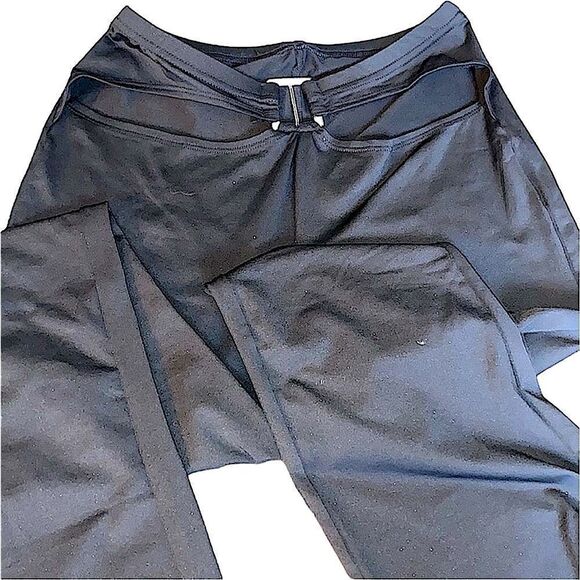 Put on black flare pants with cut out waste accent and silver accessory. Stretch - Picture 1 of 11